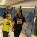 A photo of a camper and a counselor at Camp Achieve.