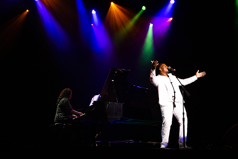 students performing in Emens Auditorium