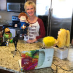 Counselor uses puppets to connect to students