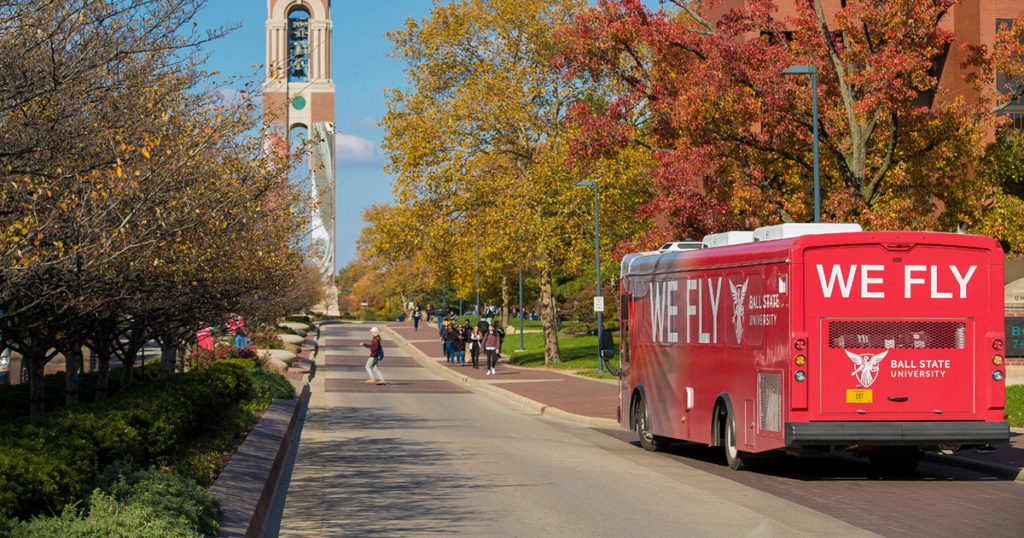 A Ball State shuttle bus stops to pick up students.