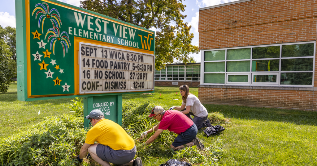 United Ways Volunteers from Ball State University planting a garden at West View Elementary School