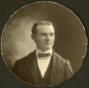 Sepia photo of a man in a suit