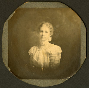 Sepia photo of a woman in a dress