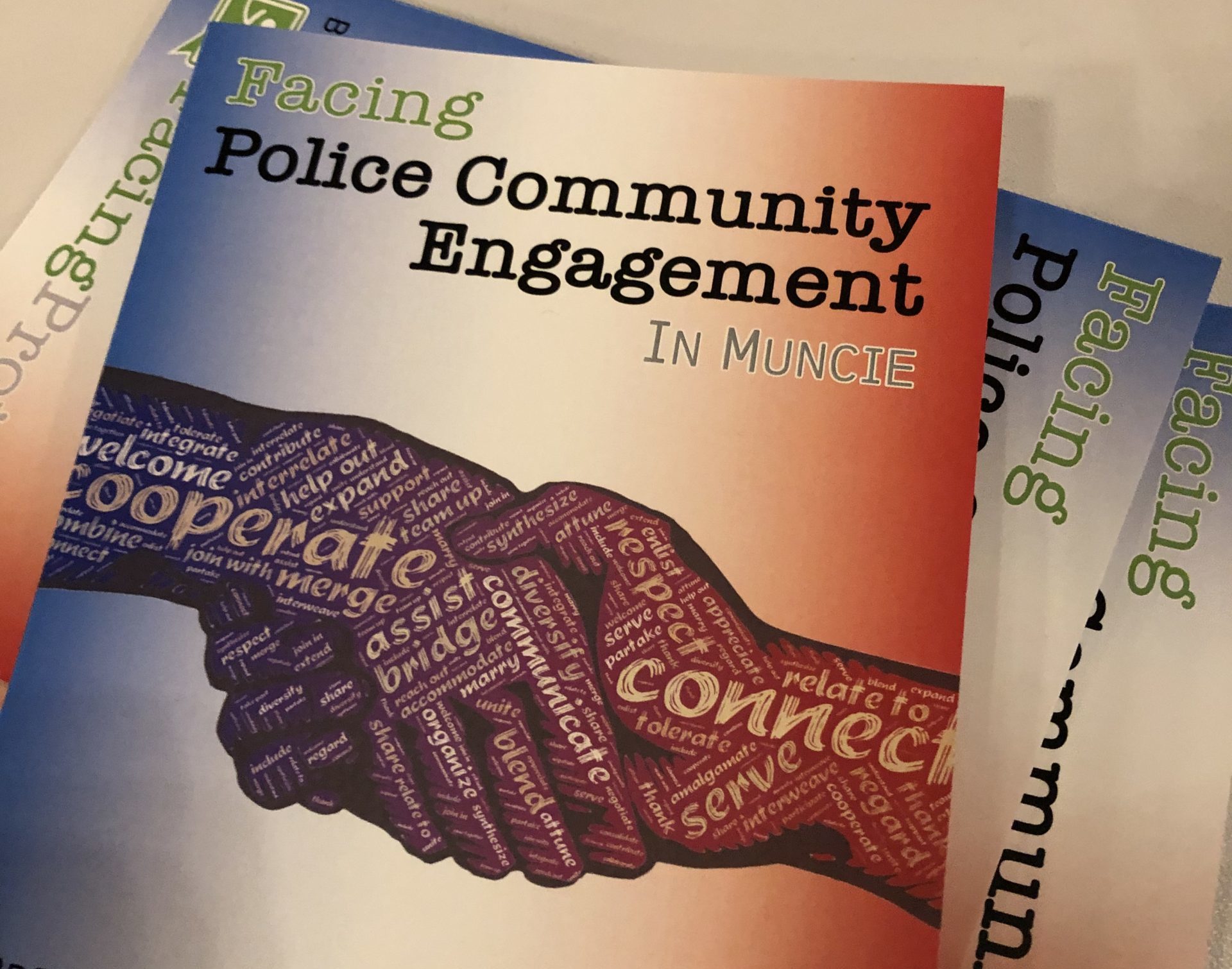 Photo of a booklet for the Facing Police Community Engagement Event in Muncie, Indiana