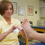 Michelle Lamb wrapping a foot