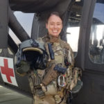 Cory Hasik in uniform standing hear a helicopter