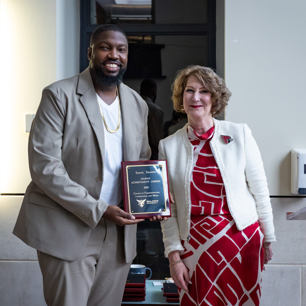 Samuel Sirmons accepts a Hall of Beneficence Award