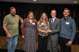 Members of the 8twelve Coalition stand with President Mearns at the award ceremony